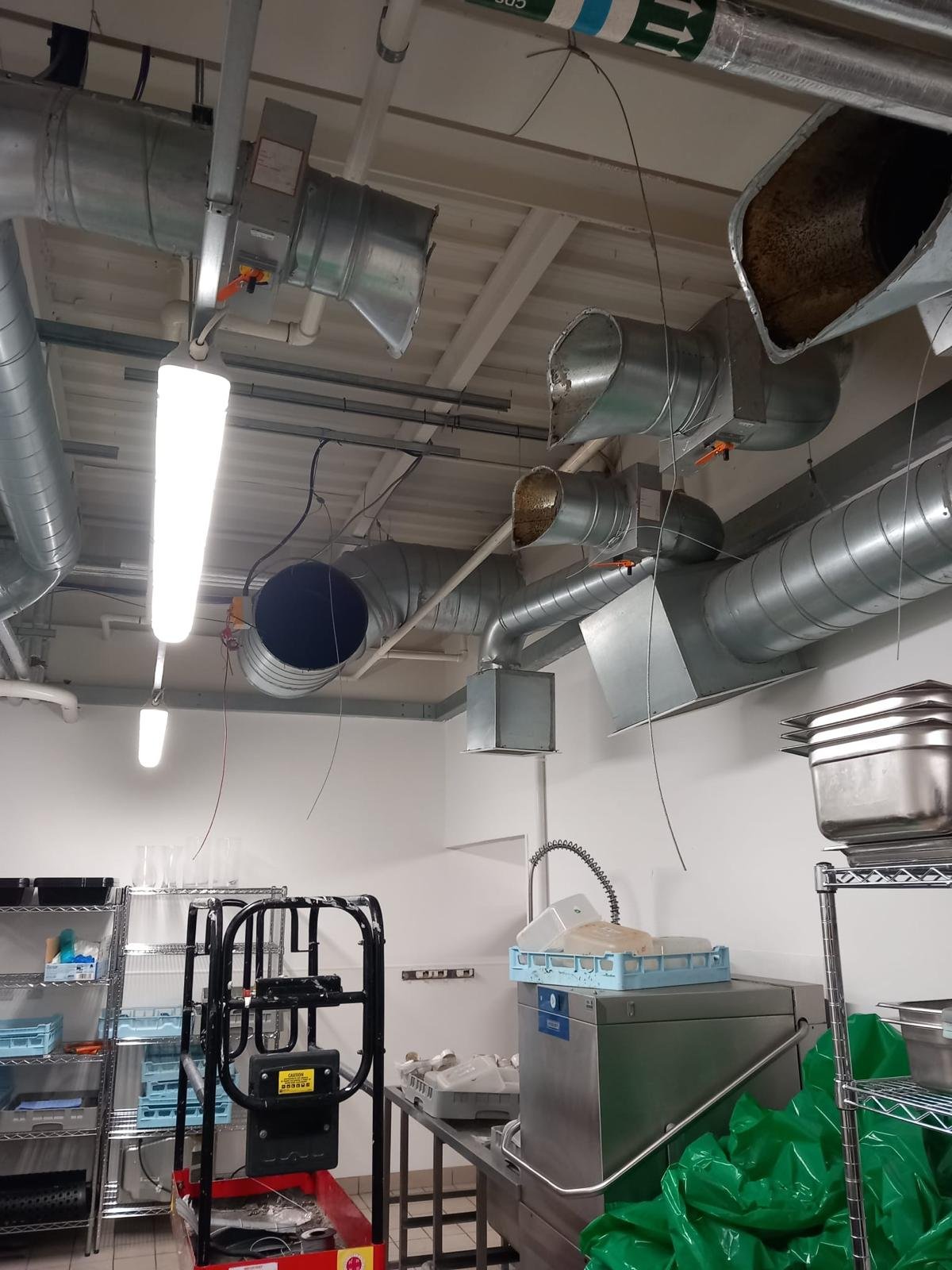 Commercial electrical installation featuring industrial ducting, LED lighting, and wiring solutions by U & O Electrical